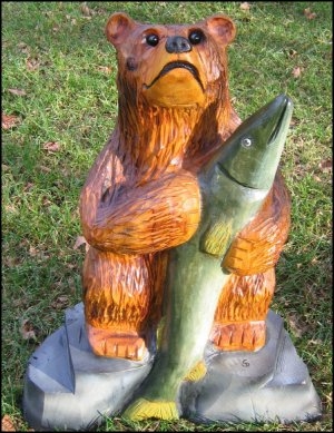 chainsaw carved bear sculpture with fish