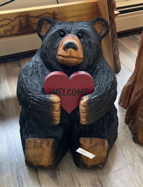 chainsaw carved bear with heart