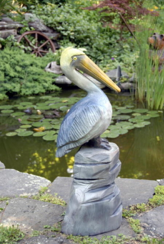 chainsaw carved pelican sculpture